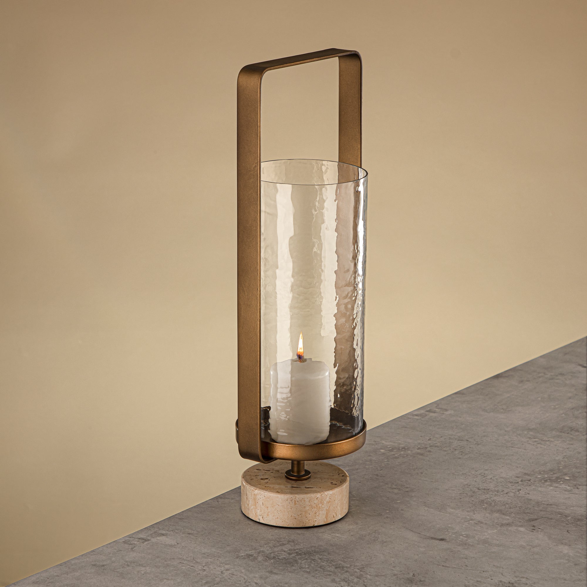 Almarjan Kalon Hurricane Lantern Hammered Clear Glass 16x10.5x43.5 CM Brushed Gold & Travertine Base (GMT2960029)